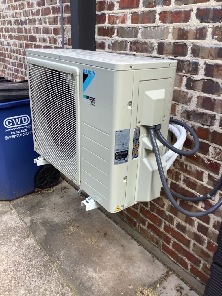 Part of a mini ductless split system installed at a house.